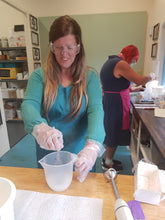 a student mixing their lye solution