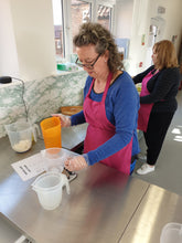 a student measuring out ingredients